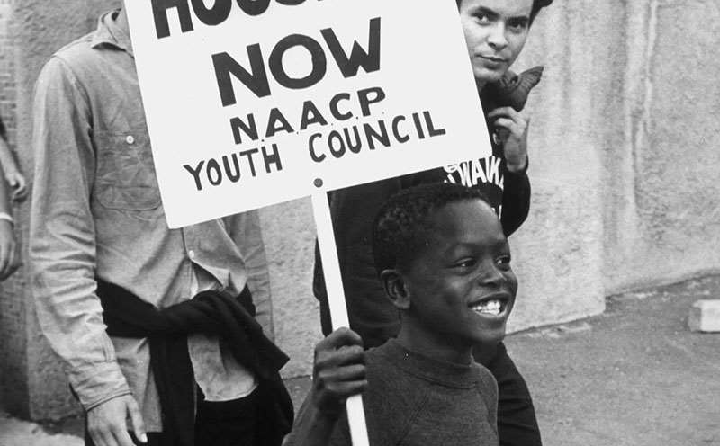 Youth protesting with signs